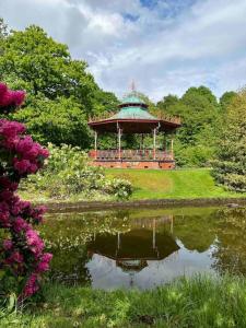 a gazebo in the middle of a pond in a park at Liverpool Victorian Townhouse - 3 Bedrooms in Liverpool