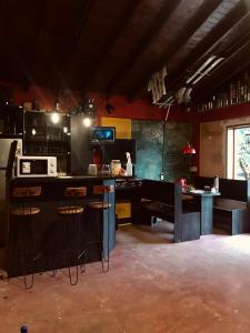 a kitchen with a bar and stools in a room at El Carretero in Ushuaia