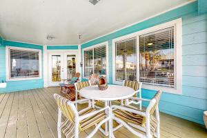 a dining room with a table and chairs at Beach House #0229 in South Padre Island