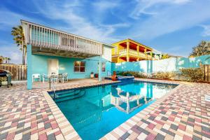 a swimming pool in front of a house at Beach House #0229 in South Padre Island