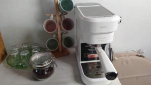 a coffee maker sitting on a counter next to a mixer at La Cuadra de Pascuala in Tajace de Abajo