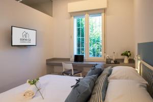Postel nebo postele na pokoji v ubytování Suite Apartments - Corso51