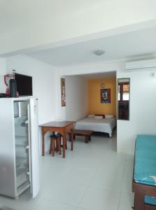 TV a/nebo společenská místnost v ubytování Pousada Residence Vila das Flores