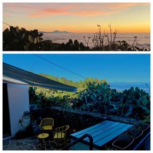 a view of the ocean from a house with a bench at La Cuadra de Pascuala in Tajace de Abajo