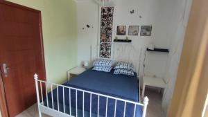 Postel nebo postele na pokoji v ubytování The Olive Garden Apartment