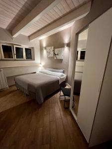 Postel nebo postele na pokoji v ubytování Hotel Bella Napoli ristorante & spa