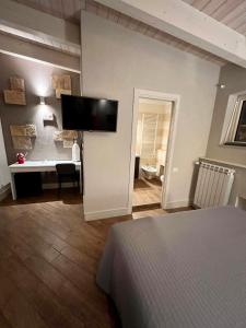 TV a/nebo společenská místnost v ubytování Hotel Bella Napoli ristorante & spa