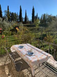 a table with two chairs and a table cloth on it at Agriturismo Cervano in Toscolano Maderno
