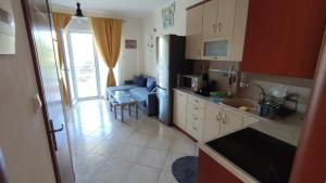 Kuchyň nebo kuchyňský kout v ubytování The Olive Garden Apartment