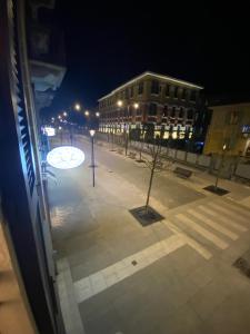 a view of a street at night from a window at Camere La Meridiana in Domodossola