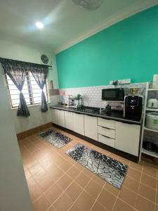 A kitchen or kitchenette at Dj Impiana Homestay @ Bukit Keluang Besut