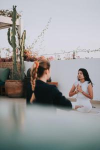 a bride and groom sitting in front of a mirror at Vent Des Dunes in Essaouira +133 photos
