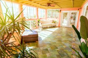 a living room with a couch and a table at Magical Bay View in Oakland Hills in Oakland