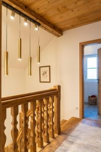 a staircase in a house with wooden ceilings at Haus Stangl in Bad Aussee