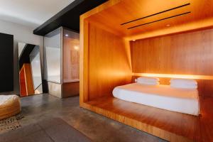 A bed or beds in a room at Selina Chelsea