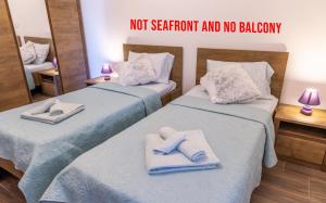 Postel nebo postele na pokoji v ubytování Villa Umag Seafront