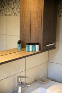 a kitchen with a sink and a counter with cups at Amarianos Villas in Agia Effimia