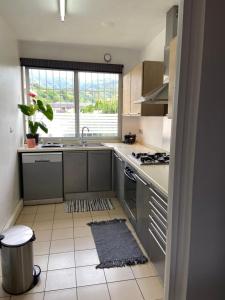 a kitchen with a sink and a stove at Manaeva L3 in Papeete