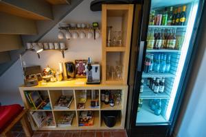 a refrigerator filled with lots of food and drinks at Hotel Das Brückenhaus in Glückstadt