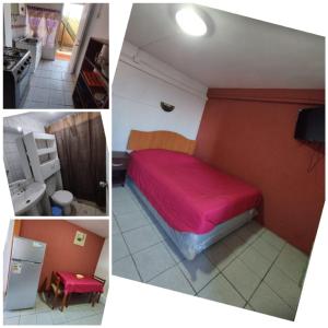 1 dormitorio con cama roja y cocina en Descanso Tren del tata, en Quintero