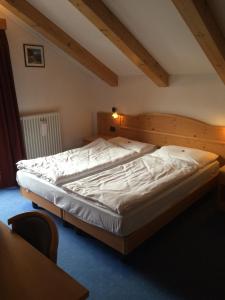 Postel nebo postele na pokoji v ubytování Hotel El Geiger