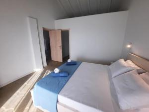 Postel nebo postele na pokoji v ubytování Sint Barbaris Perivoli