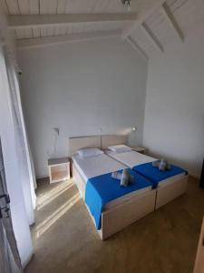 Postel nebo postele na pokoji v ubytování Sint Barbaris Perivoli