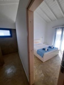 Postel nebo postele na pokoji v ubytování Sint Barbaris Perivoli