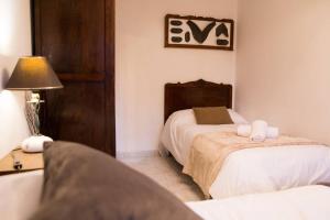 A bed or beds in a room at A CASA DA MOREIRA - Casa rural en Ponte Maceira