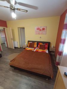 Posteľ alebo postele v izbe v ubytovaní Borostyán Apartmanház
