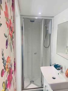 a bathroom with a shower and a sink at The Pigsty in Braunton in Braunton +6 photos
