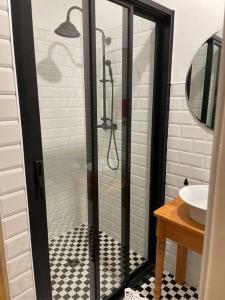 a bathroom with a shower and a sink at Swakopmund private room in family home in Swakopmund