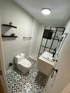 a bathroom with a toilet and a sink at Private Peaceful Paradise on One Happy Island in Oranjestad