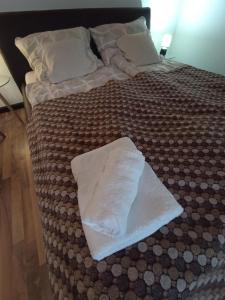 Posteľ alebo postele v izbe v ubytovaní Borostyán Apartmanház