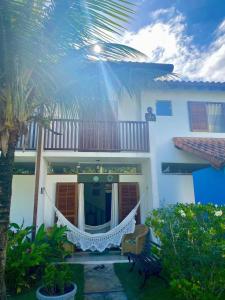 Κήπος έξω από το Casa ideal em condomínio fechado a 200m da Praia Maranduba, área de lazer completa +10 φωτογραφίες