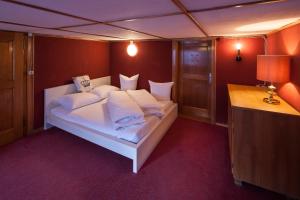 Ein Bett oder Betten in einem Zimmer der Unterkunft Alps Romantik