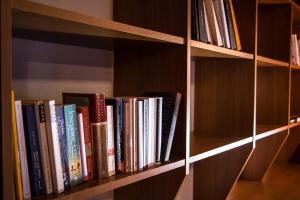 a row of books on a book shelf at Alps Romantik in Mellau