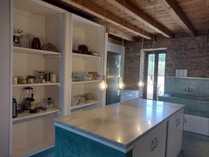 a kitchen with a large island in a room at Raphale in Preveza
