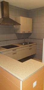 Kuchyň nebo kuchyňský kout v ubytování APARTAMENTOS SAN ANTON + 27 fotografií