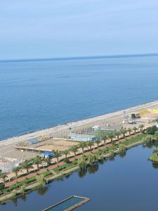 an aerial view of a beach with a train station at ORBI CITY in Batumi