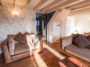 a living room with two chairs and a couch at The Pheasantry in Scarborough