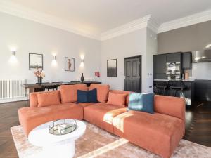 a living room with a couch and a table at The Mary Maude Suite Stone Cross Mansion in Ulverston