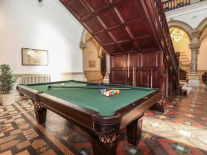 a pool table in a room with a ceiling at The Mary Maude Suite Stone Cross Mansion in Ulverston
