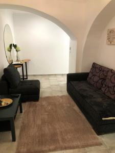 a living room with a couch and a table at NatureHouse in Campo Maior