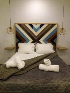 Un pat sau paturi într-o cameră la VintageHouse