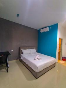 Un pat sau paturi într-o cameră la Bonda Room Stay Langkawi
