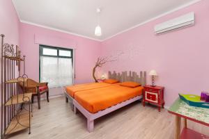 Postel nebo postele na pokoji v ubytování Al-Gharb Tavira Eco GuestHouse