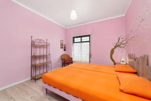 Postel nebo postele na pokoji v ubytování Al-Gharb Tavira Eco GuestHouse