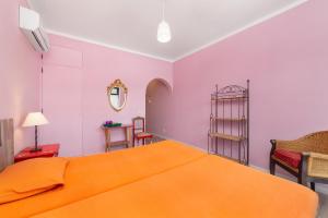 Postel nebo postele na pokoji v ubytování Al-Gharb Tavira Eco GuestHouse