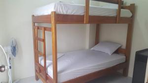 a couple of bunk beds in a room at OCEAN surf in Mompiche